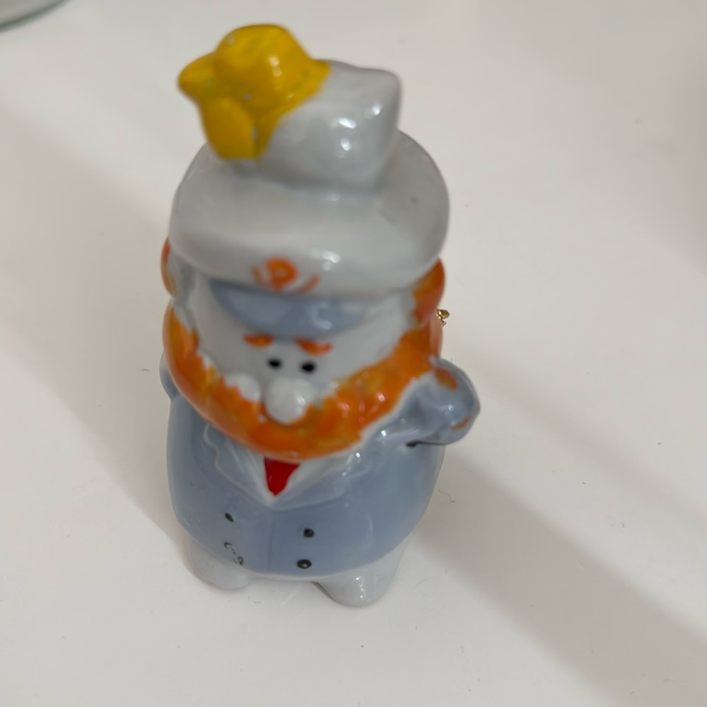 Porcelain figurine with bell .